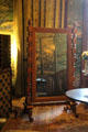 Cheval or dressing mirror mounted in ornate frame in Lower India Room at Penrhyn Castle. Bangor, Wales.