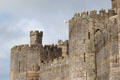 Polygonal towers & crenellations at Caernarfon Castle. Caernarfon, Wales.