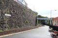 Welsh Highland Railway tracks running in front of station platform. Caernarfon, Wales.