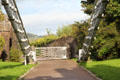 Chains supporting Telford suspension bridge anchored to the ground by a freestone & concrete plinth. Conwy, Wales.