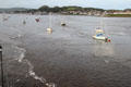 Boats anchored in Conwy harbor, part of the Conwy River leading to the Irish Sea. Conwy, Wales.