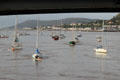 Boats anchored in Conwy harbor, part of the Conwy River leading to the Irish Sea. Conwy, Wales.