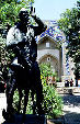 Statue in front of Bukhara's Divan Begi of wise man who agreed to teach his donkey to talk. Uzbekistan.