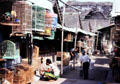 Bird market in shadow of palace wall. Jogyakarta, Indonesia.