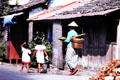Woman with daughters in street. Jogyakarta, Indonesia.
