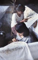 Making Batik by drawing in wax. Bali, Indonesia.