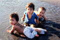 Children wading in sea. Bali, Indonesia.