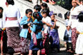 Children eating on temple day. Bali, Indonesia.