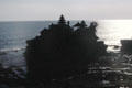 Tanah Lot temple silhouetted against the sea. Bali, Indonesia.