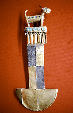 Lambayeque tumi in silver, gold & turquoise knife used for surgery is topped by Viringo which had body temperature of 39°C was used for warmth by natives in Gold Museum, Lima. Peru