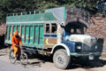Transport truck & bicyclist near Jodhpur. India.